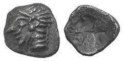 Ionia, Kolophon AR Tetartemorion. Ionia, Kolophon AR Tetartemorion. late 6th C. Archaic head of Apollo l. / Incuse square punch. SNG Kayhan 343; SNG vA 1810. 0.16g, 6mm. Dark tone, EF