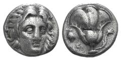 Islands off Karia, Rhodos AR Didrachm. Islands off Karia, Rhodos AR Didrachm. c. 340-316. Head of Helios facing slightly r. / Rose with bud to r.; grape bunch and E to l.; all within incuse square. As
