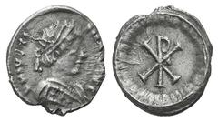Justinian I AR Half Siliqua (?). Justinian I AR Half Siliqua (?). Ravenna, 552-565. Pearl-diademed bust r., wearing robe decorated with three pellets / Large Christogram within wreath. MIBE 77; DOC 33