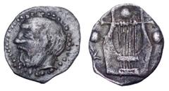 Sicily, Katane AR Tetras. Circa 455-450 BC. Bearded head of Silenos l. / Kithara; three pellets around. Boehringer, Kataneische, 1-5. 0.18g, 8mm, 11h. Very Rare. Very Fine.