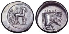 Sicily, Gela AR Tetradrachm. Circa 480-475 BC. Charioteer, holding kentron and reins, driving walking quadriga to right past Ionic column / Forepart of man-headed bull right, CEΛAΣ above. Jenkins, Gel