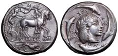 Sicily, Syracuse AR Tetradrachm. Deinomenid Tyranny. Time of Hieron I, circa 475-470 BC. Dies by the Demareteion Master. Charioteer wearing a long chiton and holding a goad in his right hand and the r
