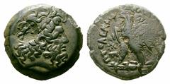 Ptolemaic Kingdom of Egypt. Ptolemy II Philadelphos Æ21. Ptolemaic Kingdom of Egypt. Ptolemy II Philadelphos Æ21. 285-246 BC. Laureate head of Zeus right; countermark / Eagle standing left on thunderb