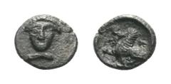 Cilicia, uncertain mint AR Tetartemorion. 4th century BC. Female head facing / Sphinx seated left, raising right paw. Troxell-Kagan 20. 0.17g, 7mm, 12h. Toned, Near Extremely Fine.