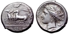 Sicily, Panormos AR Tetradrachm. Circa 310-290 BC. Charioteer holding kentron and reins, driving fast quadriga left; Nike flying above to crown charioteer; Punic 'ZIZ' between two dolphins below doubl