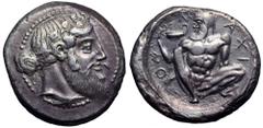 Sicily, Naxos AR Tetradrachm. Circa 460 BC. Bearded head of Dionysos right, wearing ivy wreath, his hair tied in a krobylos behind / Nude, bearded and ithyphallic Silenos squatting facing, head left, 