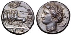 Sicily, Syracuse AR Dekadrachm. Time of Dionysios I, circa 450-370 BC. Charioteer driving galloping quadriga to left, holding kentron in right hand, reins in left; above, Nike flies to right, a wreath
