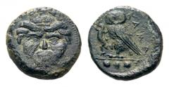 Sicily, Kamarina Æ Tetras. Circa 420-405 BC. Gorgoneion with tongue protruding / Owl standing right, grasping lizard. Westermark & Jenkins 195.14; CNS III, p. 58, 26; HGC 2, 547. 2.84g, 14mm, 2h. Very