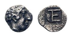 Ionia, Kolophon AR Tetartemorion. Circa 450-410 BC. Laureate head head of Apollo / TE monogram in incuse square. SNG Kayhan 359. 0.24g, 7mm, 8h. Very Fine. Rare.