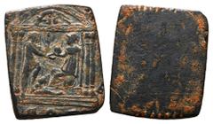 Roman Æ Solidus Weight. Mid-Late 4th century AD. Square Solidus weight made of a Nummus (Nummus) of Maxentius (AD 307-312); Obverse is blank with visible filing on edge for weight adjustment; Reverse;