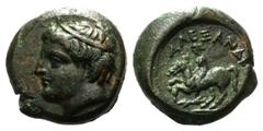 Kingdom of Macedon. Philip III Arrhidaios Æ18. Uncertain mint in Macedon, 323-317 BC. Struck in the name of Alexander III. Youthful head of Apollo left, wearing tainia / Rider on horse prancing left; 