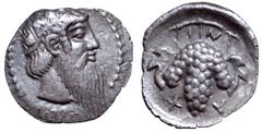 Sicily, Naxos AR Litra. Circa 461-430 BC. Head of Dionysos right, wearing ivy wreath / Grape bunch on vine; leaf hanging at each side, NAXI around. Cahn, Naxos 62 (V45/R53). 0.69g, 11mm, 3h. Extremely
