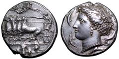 Sicily, Syracuse AR Dekadrachm. Time of Dionysios I, circa 400 BC. Charioteer driving galloping quadriga to left, holding kentron in right hand, reins in left; above, Nike flies to right, a wreath in 