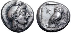 Attica, Athens AR Tetradrachm. Circa 510-490 BC. Archaic head of Athena to right, wearing crested helmet decorated with chevron pattern and spiral / Owl standing to right, head facing, olive sprig beh