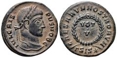 Crispus, as Caesar, Æ Nummus. Siscia, AD 320-321. IVL CRISPVS NOB C, laureate head right / CAESARVM NOSTRORVM, VOT•V in two lines within wreath; ΓSIS* in exergue. RIC 161. 2.79g, 19mm, 6h. Fleur de Co