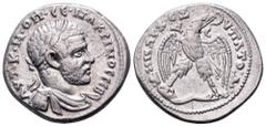 Macrinus AR Tetradrachm of Antioch, Syria. AD 217-218. AVT•K•M•OΠ•CԐ•MAKPINOC CԐB, laureate, draped and cuirassed bust right / ΔHMAPX ЄΞ VΠATOΔ, eagle standing facing on leg and thigh of animal, head 