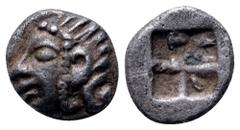 Ionia, Kolophon AR Tetartemorion. Circa 530-500 BC Archaic head of Apollo left / Incuse square punch. SNG Kayhan 343; SNG Copenhagen -; SNG von Aulock 1810. 0.31g, 6mm. Good Very Fine.