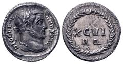 Roman Imperial Diocletian AR Argenteus. Aquileia, AD 300. DIOCLETIANVS AVG, laureate head right / XC•VI A Q in two lines within wreath with large central jewel at the top. RIC 16a; RSC 548b. 3.78g, 17