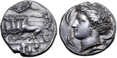Greek Sicily, Syracuse AR Dekadrachm. Time of Dionysios I, circa 405-370 BC. Charioteer driving galloping quadriga to left, holding kentron in right hand, reins in left; above, Nike flies to right, a 