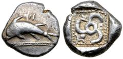 Greek Dynasts of Lycia, Kuprilli AR Stater. Circa 480-440 BC. Dolphin leaping to left over decorative line; symbol above / Triskeles, K-O around, floral ornament in corner. cf. for type Mørkholm-Zahle