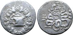 Greek Mysia, Pergamon AR Cistophoric Tetradrachm. Circa 76-67 BC. Serpent emerging from cista mystica; all within ivy wreath / Two serpents entwined around bow and bowcase; TH and monogram above, civi