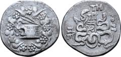 Greek Mysia, Pergamon AR Cistophoric Tetradrachm. Circa 76-67 BC. Serpent emerging from cista mystica; all within ivy wreath / Two serpents entwined around bow and bowcase; TH and monogram above, civi