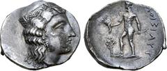 Greek Crete, Tylisos AR Stater. Circa 320-270 BC. Head of Hera to right, wearing pendant earring and stephanos decorated with palmettes / Apollo standing to left, right leg advanced, holding bow in le