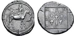 Greek Macedon, Mende AR Tetradrachm. Circa 460-423 BC. Dionysos, bearded, wearing himation and holding kantharos, reclining to left on the back of a donkey standing to right; before, a crow standing o