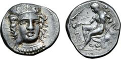 Greek Bruttium, Kroton AR Stater. Circa 400-325 BC. Head of Hera Lakinia facing slightly right, wearing stephane ornamented with palmette flanked by griffins / Young Herakles reclining left on rock dr