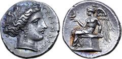 Greek Bruttium, Terina AR Stater. Circa 380 BC. Head of the nymph Terina right, wearing triple-pendant earring and pearl necklace; TEPINAIΩN before / Nike, wearing a long chiton and himation, sits lef