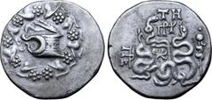 Greek Mysia, Pergamon AR Cistophoric Tetradrachm. Circa 76-67 BC. Serpent emerging from cista mystica; all within ivy wreath / Two serpents entwined around bow and bowcase; TH over monogram above, civ