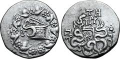 Greek Mysia, Pergamon AR Cistophoric Tetradrachm. Circa 76-67 BC. Serpent emerging from cista mystica; all within ivy wreath / Two serpents entwined around bow and bowcase; TH over monogram above, civ