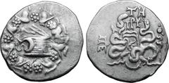 Greek Mysia, Pergamon AR Cistophoric Tetradrachm. Circa 76-67 BC. Serpent emerging from cista mystica; all within ivy wreath / Two serpents entwined around bow and bowcase; TH over monogram above, civ