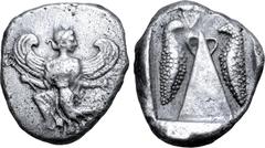 Greek Karia, Kaunos AR Stater. Circa 450-430 BC. Winged Iris in kneeling-running stance to left, head to right, holding kerykeion and wreath / Baetyl(?), with "handles" at apex; inverted Δ (K in Caria