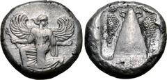 Greek Karia, Kaunos AR Stater. Circa 430-410 BC. Iris running to left, head reverted to right, holding kerykeion in right hand and wreath in left / Triangular baetyl with handle on either side of the 
