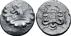 Greek Lydia, Tralleis AR Cistophoric Tetradrachm. Circa 140-135 BC. Dion-, magistrate. Serpent emerging from cista mystica; all within wreath / Two serpents entwined around bow and bowcase; ΔION above