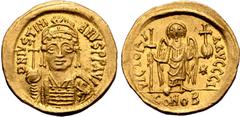 Byzantine Justinian I AV Solidus. Carthage, dated indiction year 10 = AD 546/7. D N IVSTINIANVS P P AVI, helmeted and cuirassed bust facing, holding globus cruciger and shield decorated with horseman 