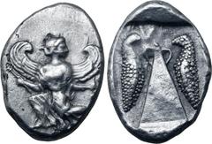 Greek Karia, Kaunos AR Stater. Circa 430-410 BC. Winged Iris in kneeling-running stance to left, head to right, holding kerykeion and wreath / Baetyl(?), with "handles" at apex; inverted Δ (K in Caria