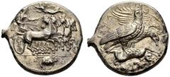 COINS OF THE GREEK WORLD SICILY Akragas Tetradrachm c. 409/406. Quadriga galloping to right, about to turn, being driven by female figure in flowing robes; above, Nike flying to l. and crowning the ch