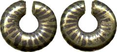 Celtic Coins. Ring money , (1st millennium BC), alternating bands of yellow and white gold, dark stripes painted over white gold bands, wt. 12.37gms. (VA.1-3), corrosion on one end, otherwise good ver