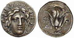 RHODES. Ca. 305-275 B.C. Didrachm.Didrachm. Radiant head of Helios facing slightly r. Rv. Rose with bud, star and Δ I in left field. 6.58 grams. SNG-Cop 735. Deep slate-gray. Minor deposit on edge. A 