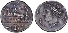 SYRACUSE. Time of Dionysios I, 405-367 B.C. Decadrachm, ca.400-390 B.C. Signed by Euainetos. Fast quadriga driven l. by female charioteer leaning forward with kentron in r. hand and reins in l. hand, 